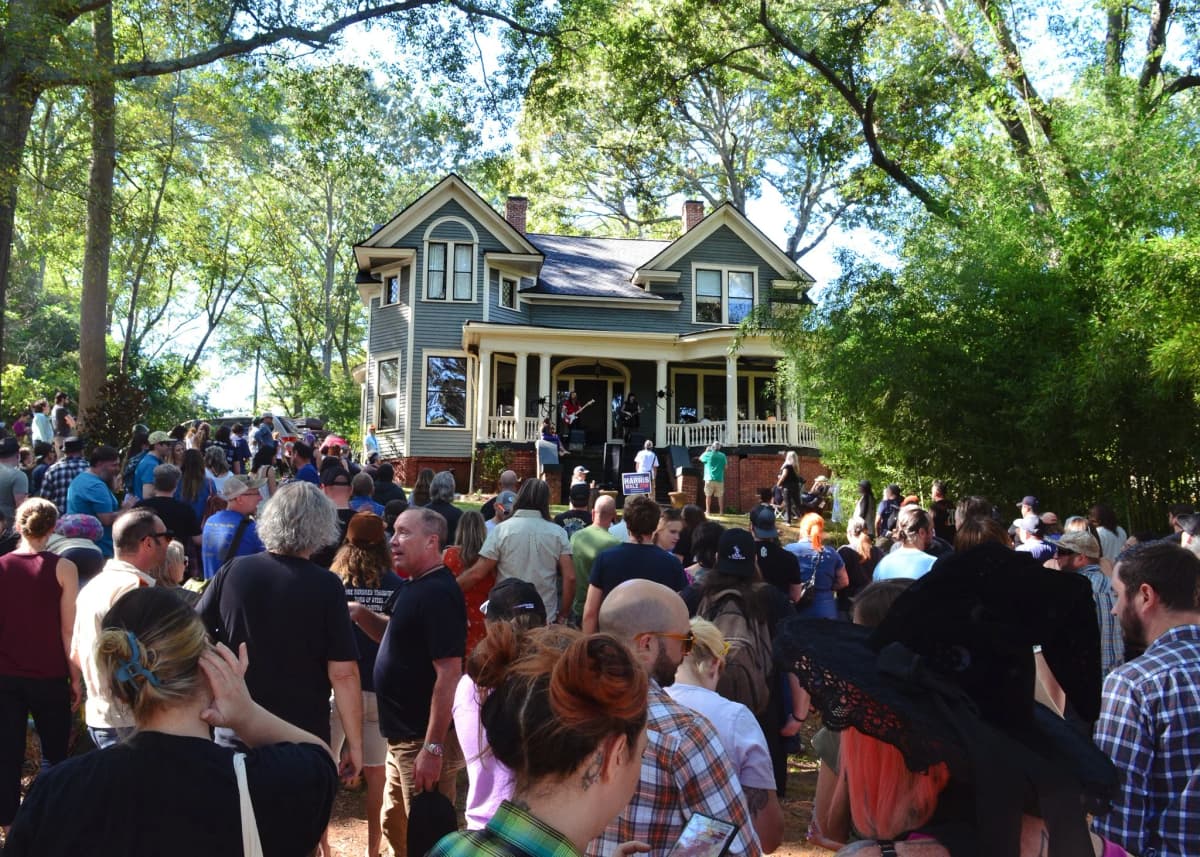 Musicians performing on a porch